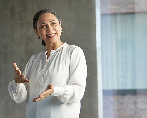 Audiologist explaining hearing aid fitting best practices in a clinical setting.