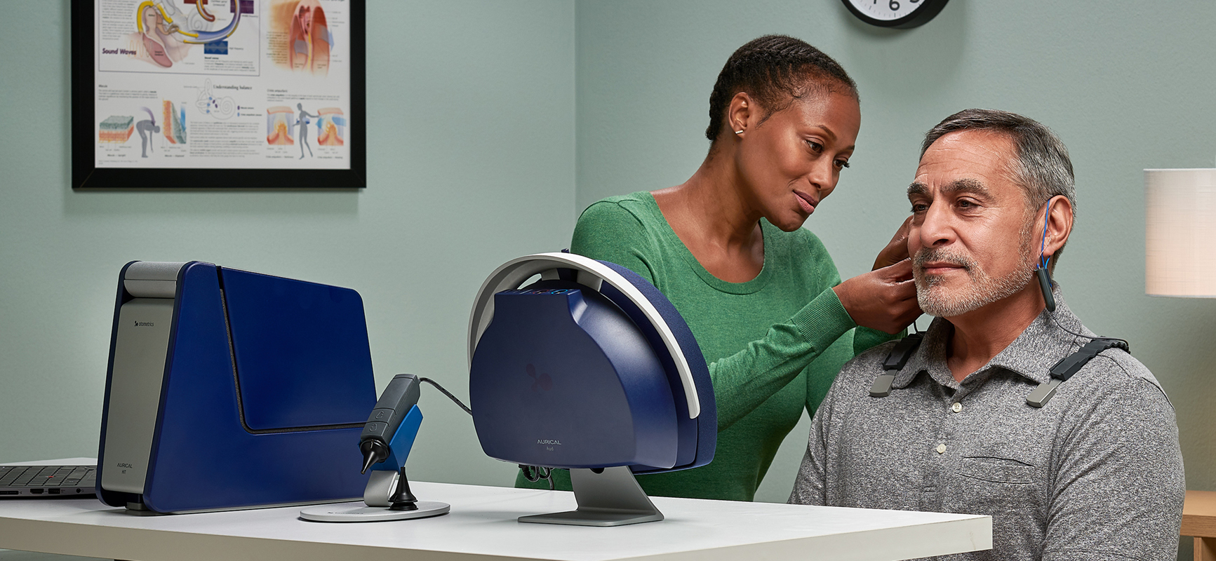 Clinician performing hearing aid fitting and verification with Aurical HIT and FreeFit.