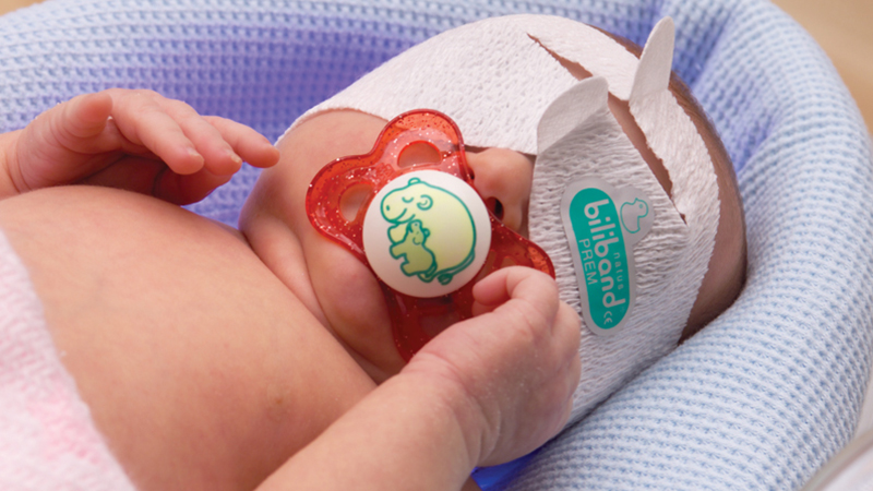 Infant wearing Biliband Eye Protector for neonatal phototherapy treatment.