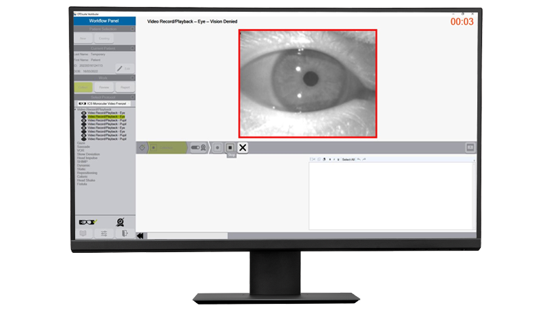 Monitor showing ICS Impulse software interface with infrared eye tracking during vision-denied vestibular test playback.