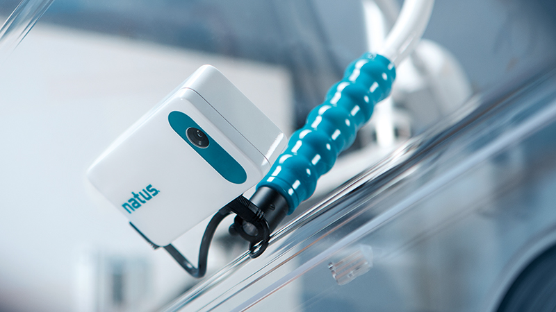 Close-up of NICVIEW 2 camera mounted inside an incubator for neonatal video streaming.