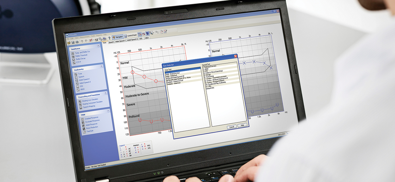 Clinician using Otosuite Audiometry Software to view and compare audiogram results on a laptop screen.
