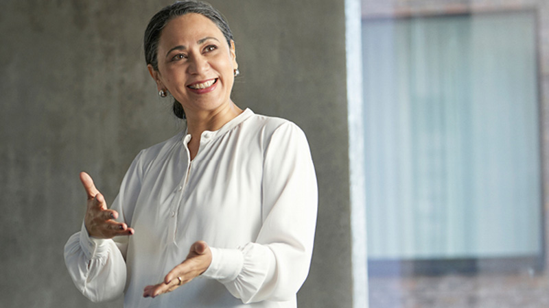 Professional audiologist presenting tips on improving hearing aid fitting workflow in audiology practice.