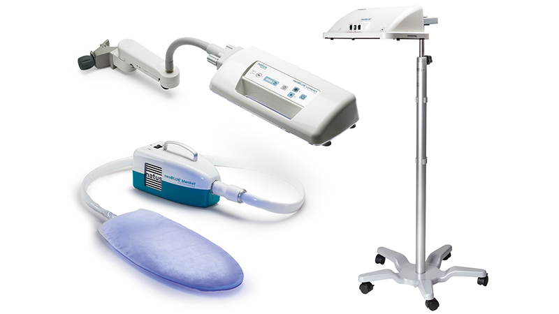 neoBLUE Radiometer with overhead and blanket phototherapy systems for neonatal bilirubin treatment and irradiance monitoring.